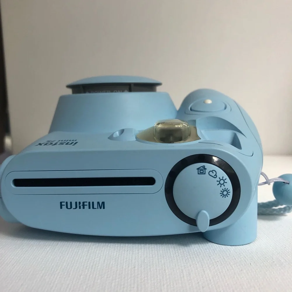 Blue instax mini 7s Polaroid camera